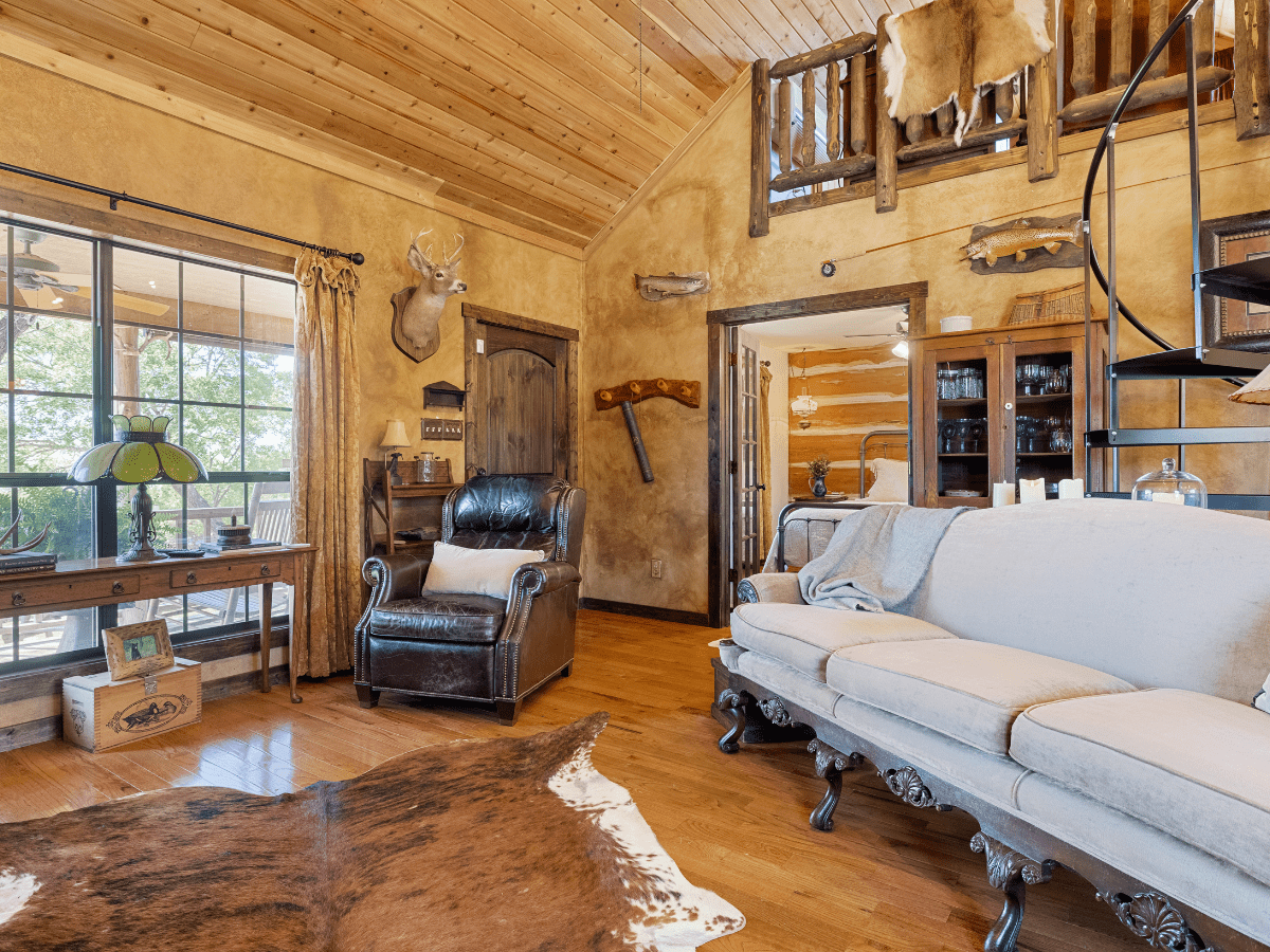 Image of white couch and greatroom in Cabin at Inn at Sunset Mill ranch