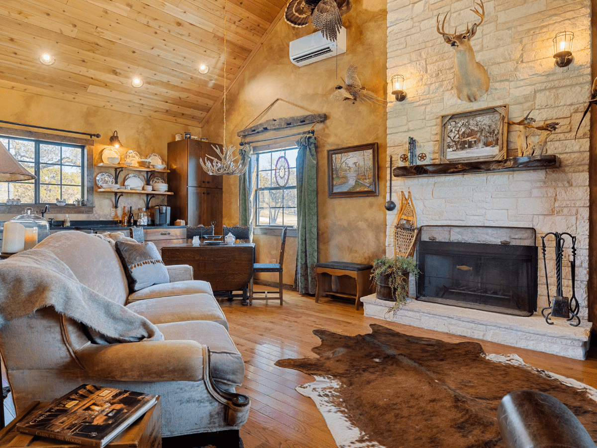 Image of couch and fireplace and greatrooom in Cabin at Inn at Sunset Mill ranch