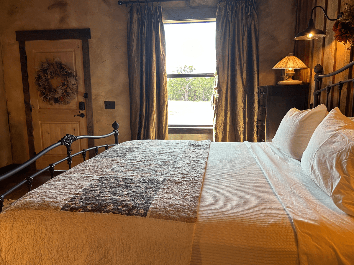 Image of King Bed with view out window on ranch in texas
