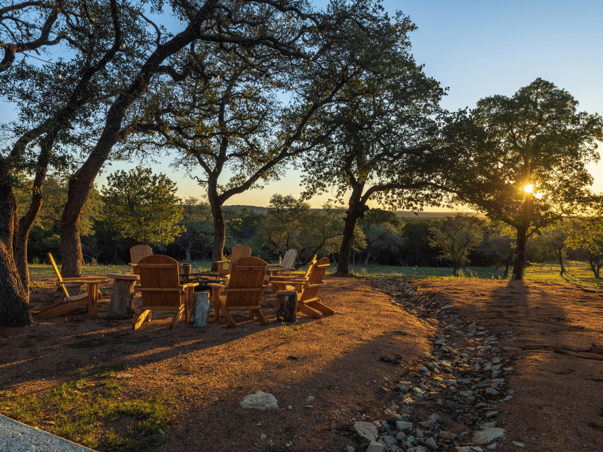 Image of adirondak chairs around firepit at Ranch in Texas Hill Country