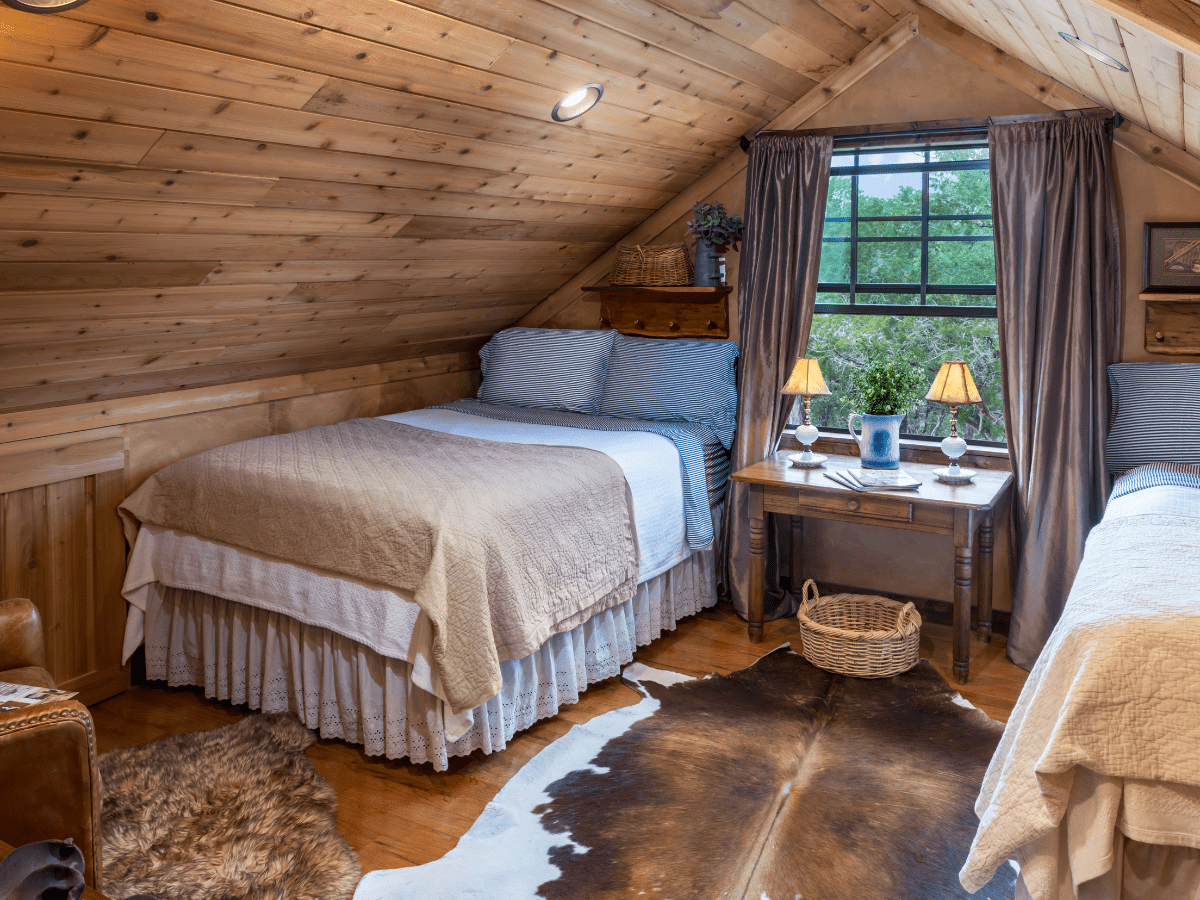 Image of twin beds in loft at Inn at Sunset Mill Ranch in Wimberley Texas