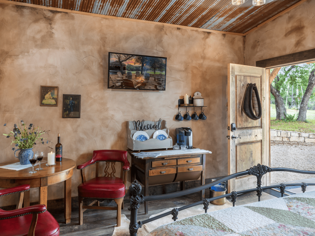 Inn_at_Sunset_Mill_Ranch_Wimberley_Hotel_granary_room - Inn at Sunset Mill Ranch Image of the entrance of hotel room at wimberley lodging Inn at sunset mill ranch