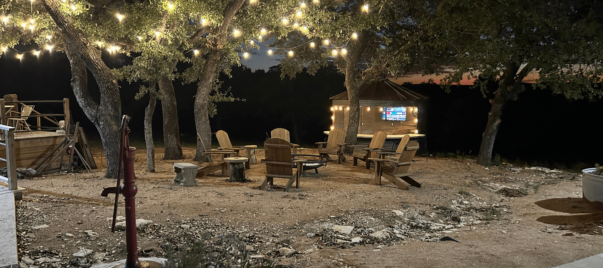 Image of firepit and big screen tv to watch football games outside in Wimberley Texas at Inn at Sunset Mill Ranch