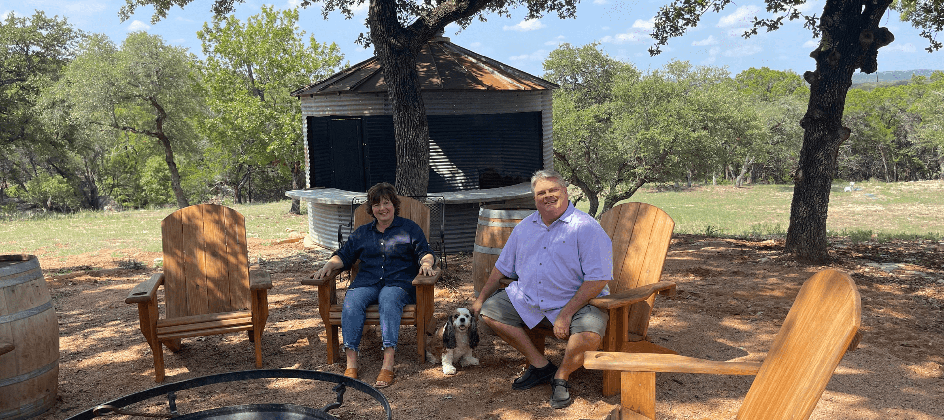 Image of Lynn and Diana and Dog Maggie around firepit at Inn at Sunset Mill Ranch